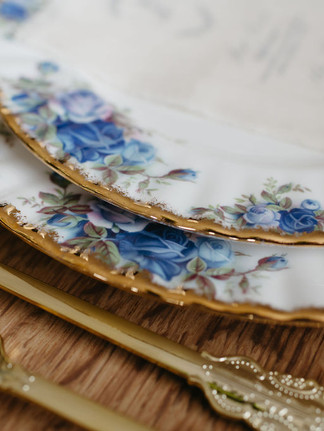 Something Blue wedding inspiration, blue wedding color palette ideas, romantic blue wedding decor, soft blue wedding florals, monochromatic blue wedding cake, vintage piped wedding cake design, blue and white wedding tablescape, Alberta styled wedding shoot, modern romantic wedding inspiration, blue floral wedding centerpiece, curated wedding dessert bar display, floral cake garden design, wedding cake with tonal blue florals, editorial wedding photography Alberta, vintage china wedding table styling, elegant blue wedding stationery, vow books wedding detail, intimate wedding venue Alberta, real couple cake cutting moment, timeless blue wedding theme