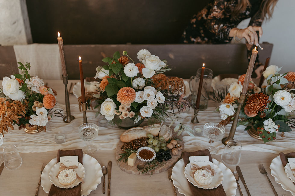 Welcoming dinner party table with seasonal food, desserts, candles, and flowers, creating an inviting setting for gathering with family and friends