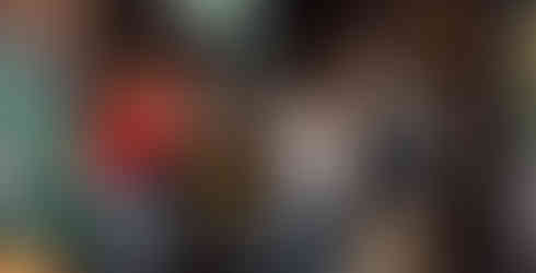 Crowd Cheering for Iowa Hawkeyes in a bar outside.