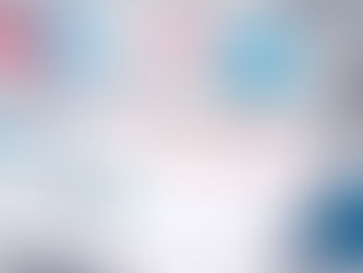 Clean, well-lit laboratory still life featuring a Moderna-branded clipboard on a white workbench, with a vaccine vial, syringe, test tubes, and scientific glassware arranged nearby, and a tablet displaying a DNA graphic in the background, conveying modern biotechnology research.