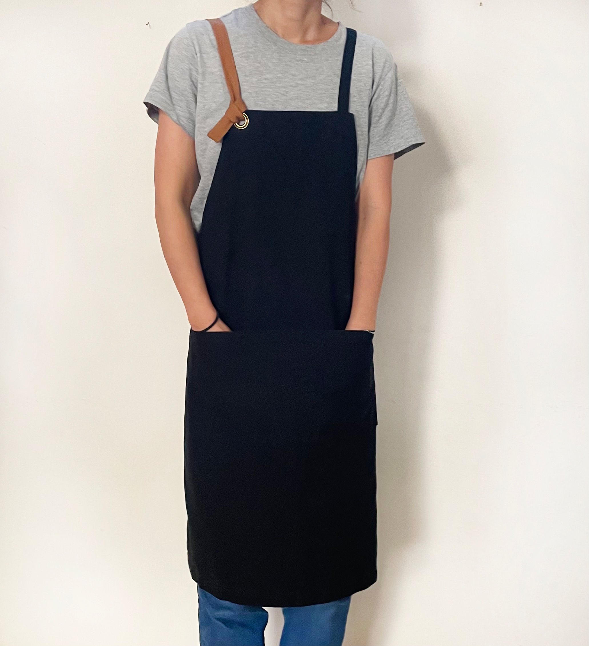 G.K.P. Organic Cotton Cross Back Apron: Black Canvas with Caramel strap