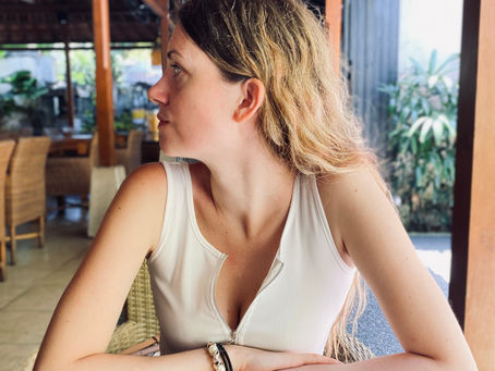 Side profile of a woman sitting in Bali, it's to show about hot weather