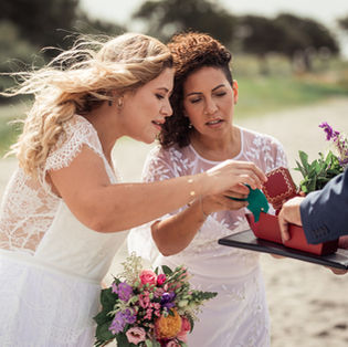 A beautiful lesbian couple at their beach wedding ceremony in Denmark where same-sex marriages are legal