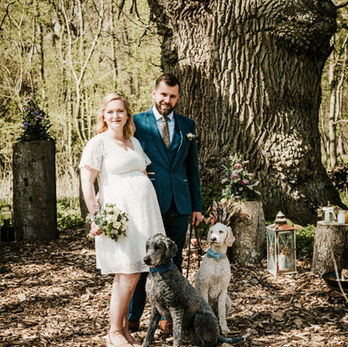 A cozy woodland wedding elopement in Denmark, featuring a minimalist ceremony surrounded by lush greenery.