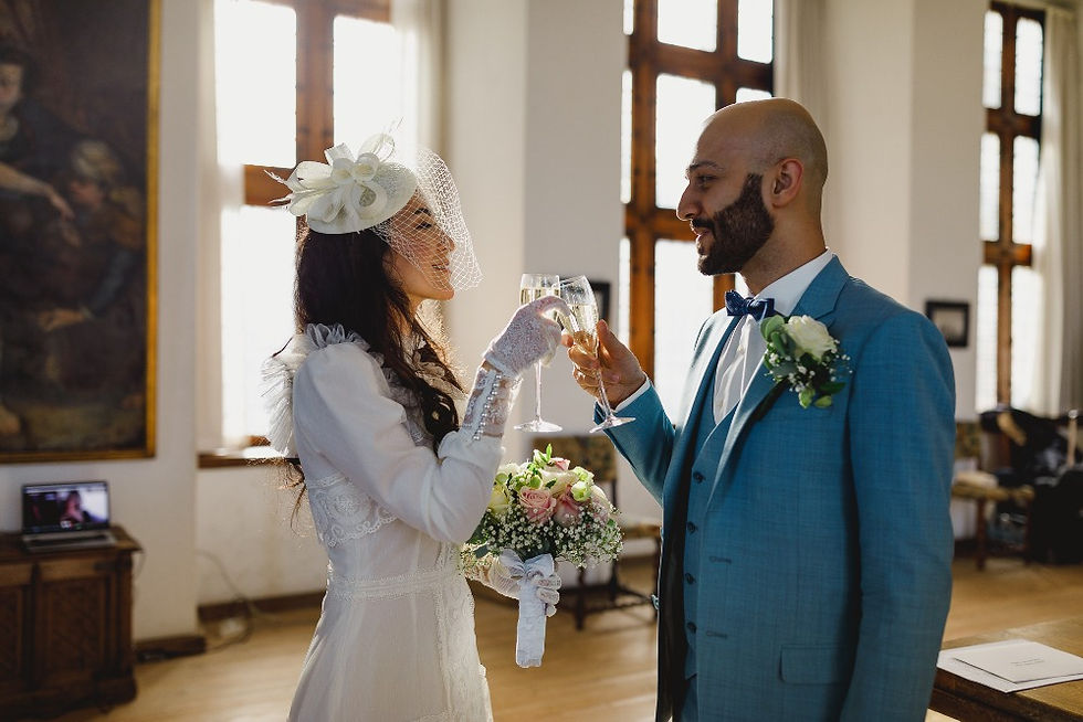 Couple toasting while they get married in the castle