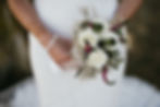 A wedding bouquet in the white colors.
