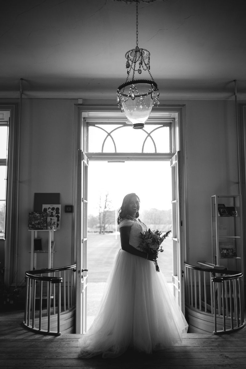 A bride at her wedding day in Denmark, posing in Pederstrup museum