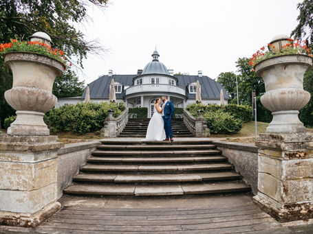 The couple In the front of the Aldershvile castle pavilion - Denmark best wedding venue