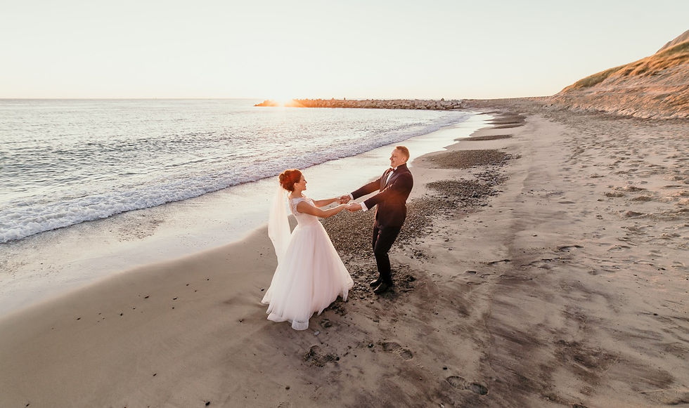 Newlyweds enjoying an intimate beach wedding moment on the Danish coast