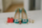 Shoes, rings and parfum on the table