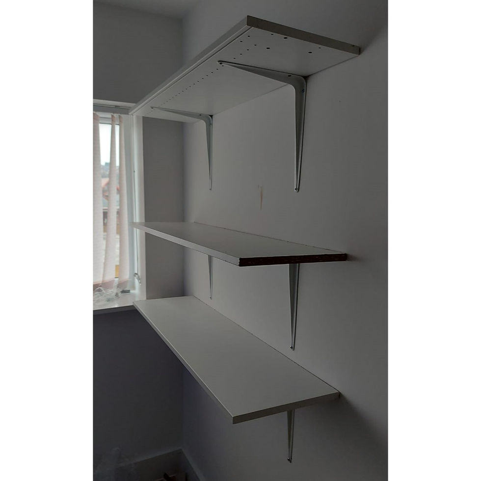 Cut these shelves to size from some sections of wardrobe that were damaged in transit, then affixed to the wall with brackets