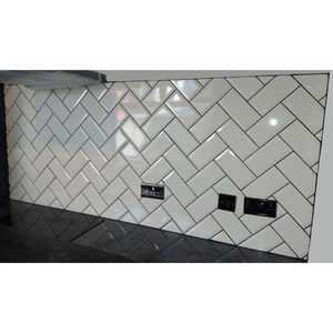 Kitchen backsplash - cream metro tiles in herringbone pattern with black grout