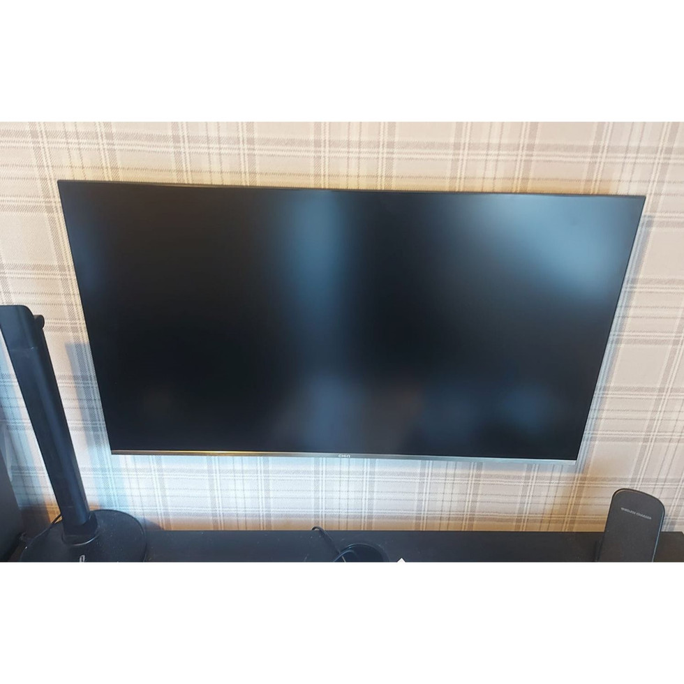 Computer monitor mounted on plasterboard wall