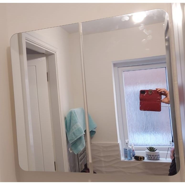 Curved door mirrored cabinet