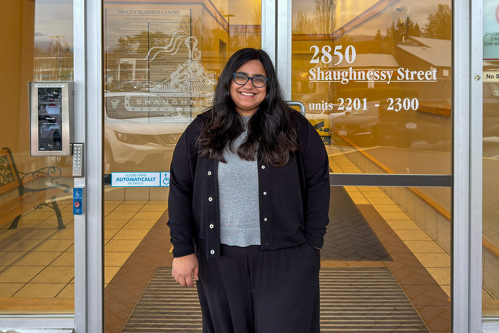 Nivedita Ashok counsellor in Port Coquitlam standing outisde Deeply Rooted Counselling at 2850 Shaughnessy Street