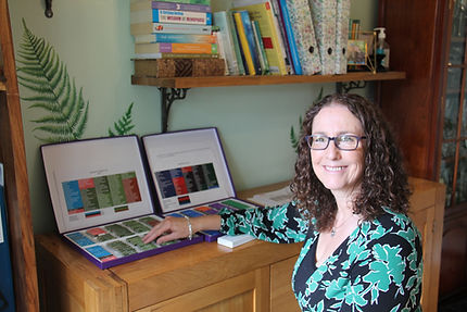 Gail with kinesiology vials used to identify digestive imbalances