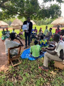 Parent Support Group (one of our programs) with Bruno (our Uganda Project Coordinator) teaching