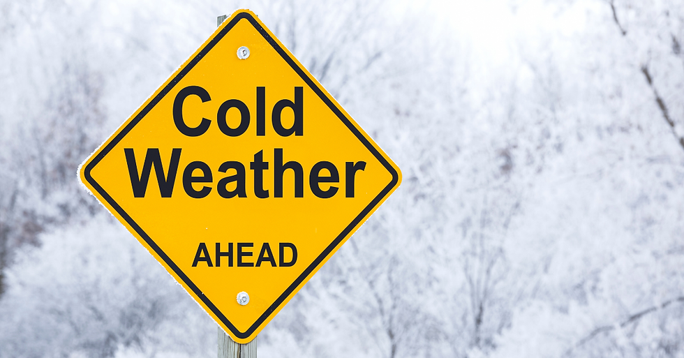 Yellow sign reads "Cold Weather Ahead" against a snowy background. Signaling the importance of winter HVAC maintenance.