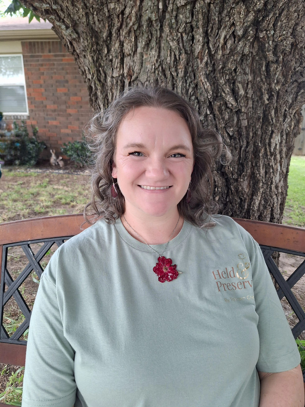 Samantha of Held & Preserved, Owner and Artist specializing in floral preservation in Weatherford, Texas, wearing a preserved rose necklace.
