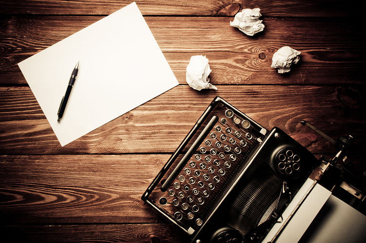 Vintage typewriter and a blank sheet of