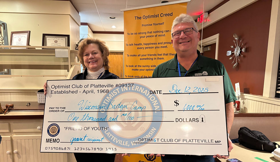 Herb Cody Accepts Donation on Behalf of Wisconsin Badger Camp