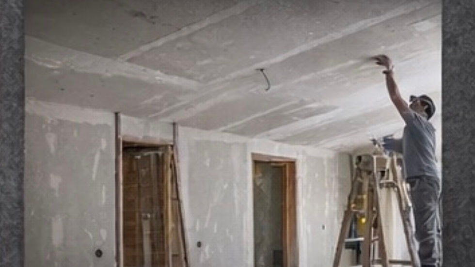 Contractor installing drywall on a ceiling in a residential renovation, showing the added labor and difficulty of ceiling drywall installation