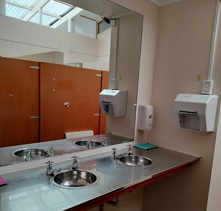 The 2 unisex showers shower cubicles and unisex toilet