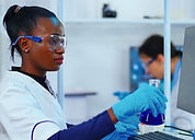 black-woman-biologist-researching-using-computer-modern-equipped-laboratory-multiethnic-st