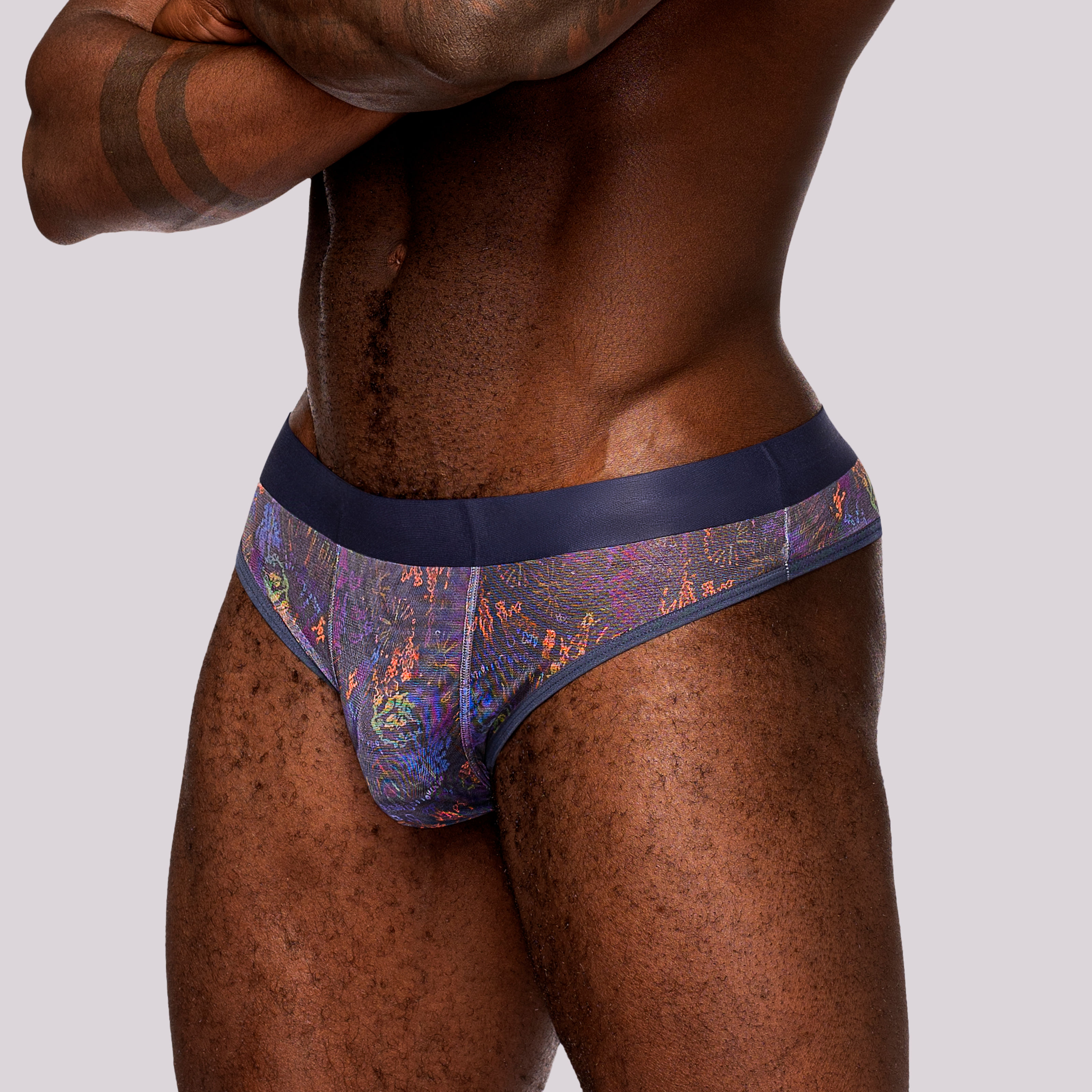 Male model wear purple splatter paint sheer thong for men, front view