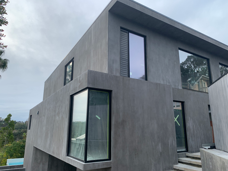 In-Situ Concrete Masonry Homes by Puddlefish Platt. Exterior View of Building Facade. 
