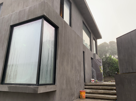 In-Situ Concrete Masonry Homes by Puddlefish Platt. Exterior View of Building Facade. 