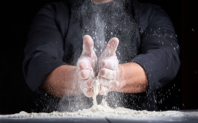 man-in-black-uniform-sprinkles-white-whe