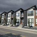 A series of four modern townhomes on a cloudy and rainy day.