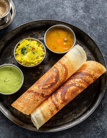 south indian dosa with sambar and coconut and coriander chutney