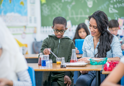 Elementary student doing a hands on science experiment