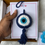 Thumbnail: Crochet evil eye hanging charm with blue tassel, handmade car and home decor