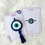 Thumbnail: Handmade evil eye rakhi with blue bead, protective thread for Raksha Bandhan