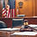 Court room with documents and gavel with an American Flag in the background.jpg