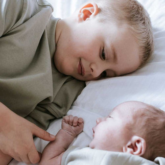 baby photoshoot at home with newborn baby and older sibling in worcestershire