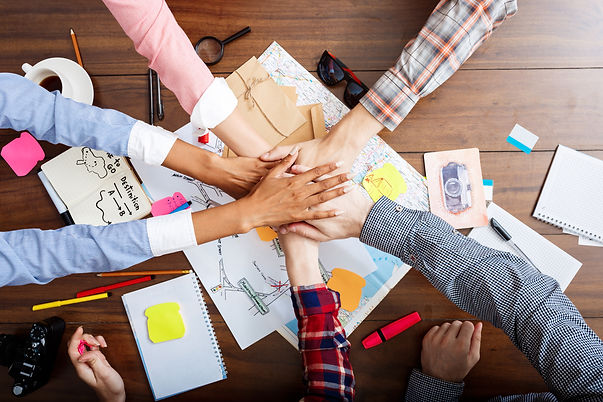 businessmen-hands-wooden-table-with-documents-drafts.jpg