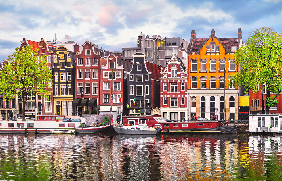 Amsterdam Netherlands dancing houses over river Amstel landmark in old european city sprin
