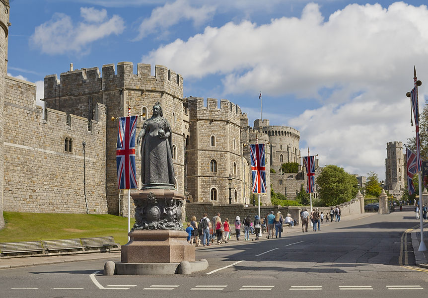 A view of Windsor Castle and Queen Victoria Statue in Windsor, England