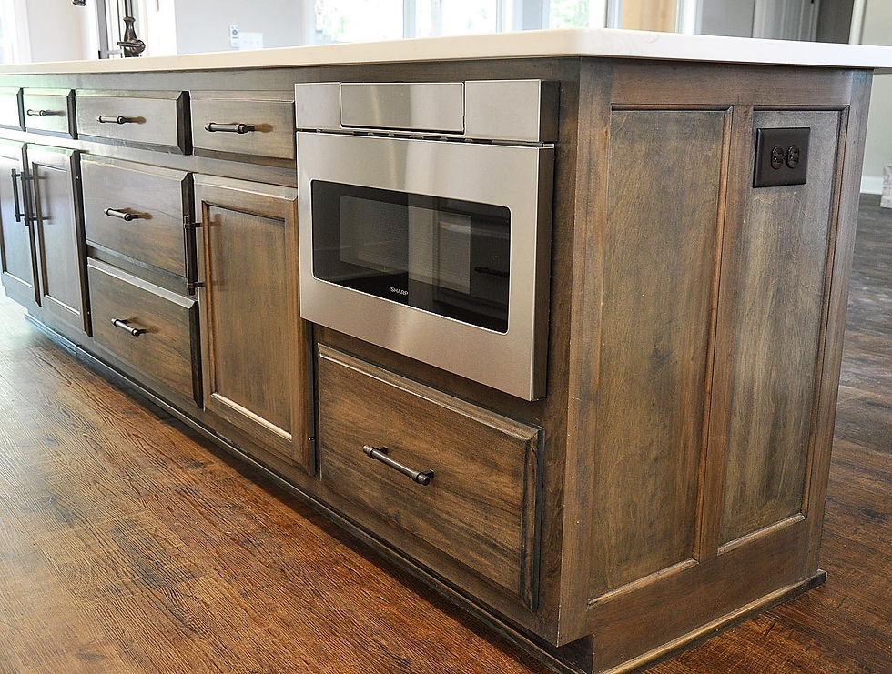 Custom kitchen wall with built-in cabinetry, microwave, and drawer storage made for utility and style.