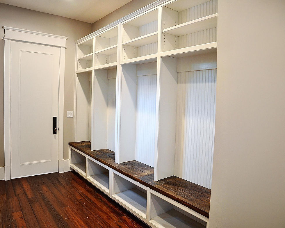Custom mudroom locker built-ins with open cubbies, beadboard backing, and bench seating in Hartsville, TN.
