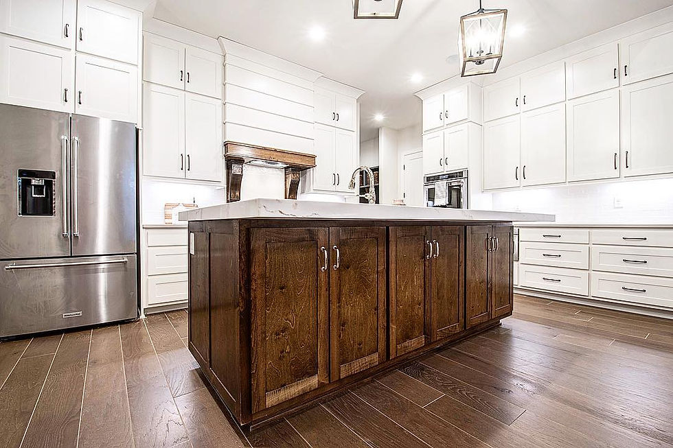 Custom kitchen featuring white cabinets and a walnut island, designed and built in Hartsville, TN.