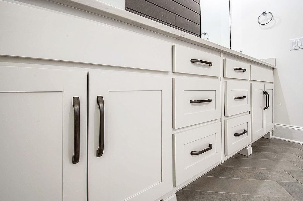 Custom white shaker-style bathroom vanity with oil-rubbed bronze hardware, built by Hartsville Cabinet & Millwork in Tennessee.