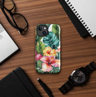 Flat-lay of iPhone 14 Pro Max Tropical Bloom case on leather desk with pen and glasses