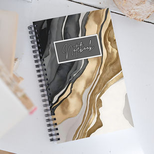 Woman writing in Eclipse Veins Luxe notebook at a café