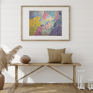 Framed Kaleidoscape abstract poster placed on a light wood shelf in a minimalist room setting