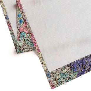 Back view of Kaleidoscape Curtain showing clean stitched hem and fabric quality with colorful printed edge.